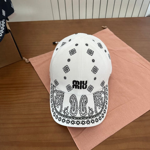 MM BASEBALL CAP IN WHITE WITH BLACK EMBROIDERED PATTERN