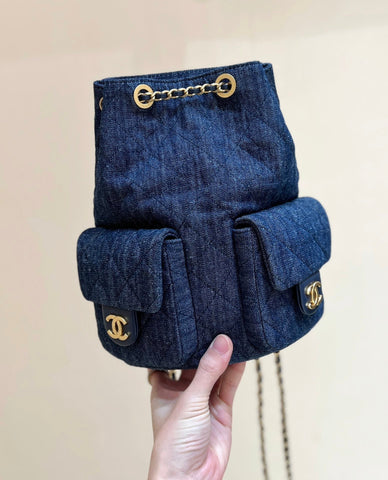 DRAWSTRING BUCKET BACKPACK 24 IN DARK BLUE DENIM GOLD HARDWARE